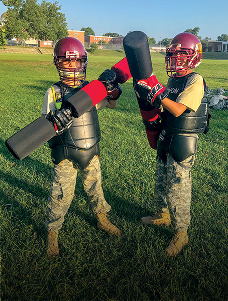 Children in battle gear