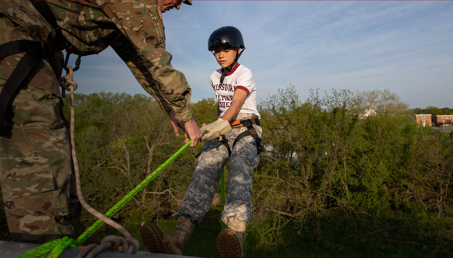 Boy learning to rappel